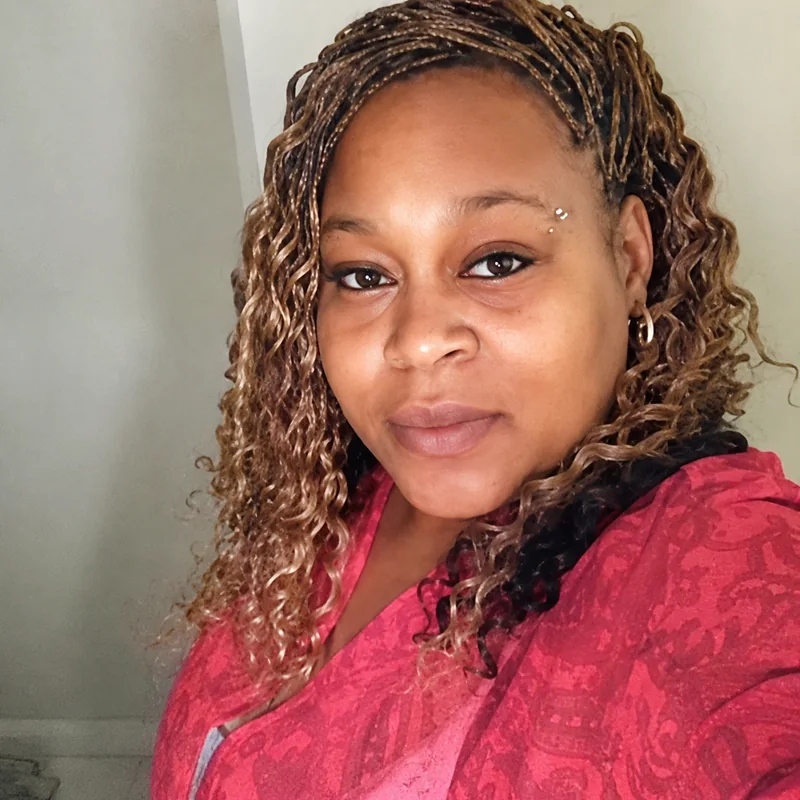 Theresa Miles, Murphy — with long braided hair, in a pink top