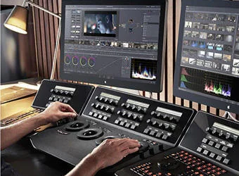 An editor grading footage in the Aitterce edit suite